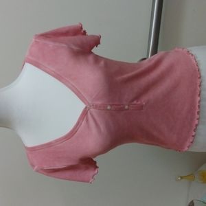 This deliberately faded pink ribbed tee is at waist.  NWT